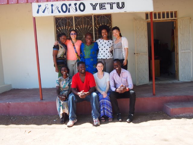 Andrea Burke Sitting With Her Team In Tanzania