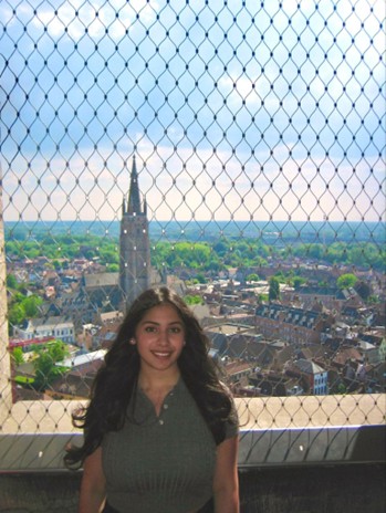 Zaina after climbing 366 steps to the top of the Belfry Tower of Bruges, a historical watchtower and treasury 